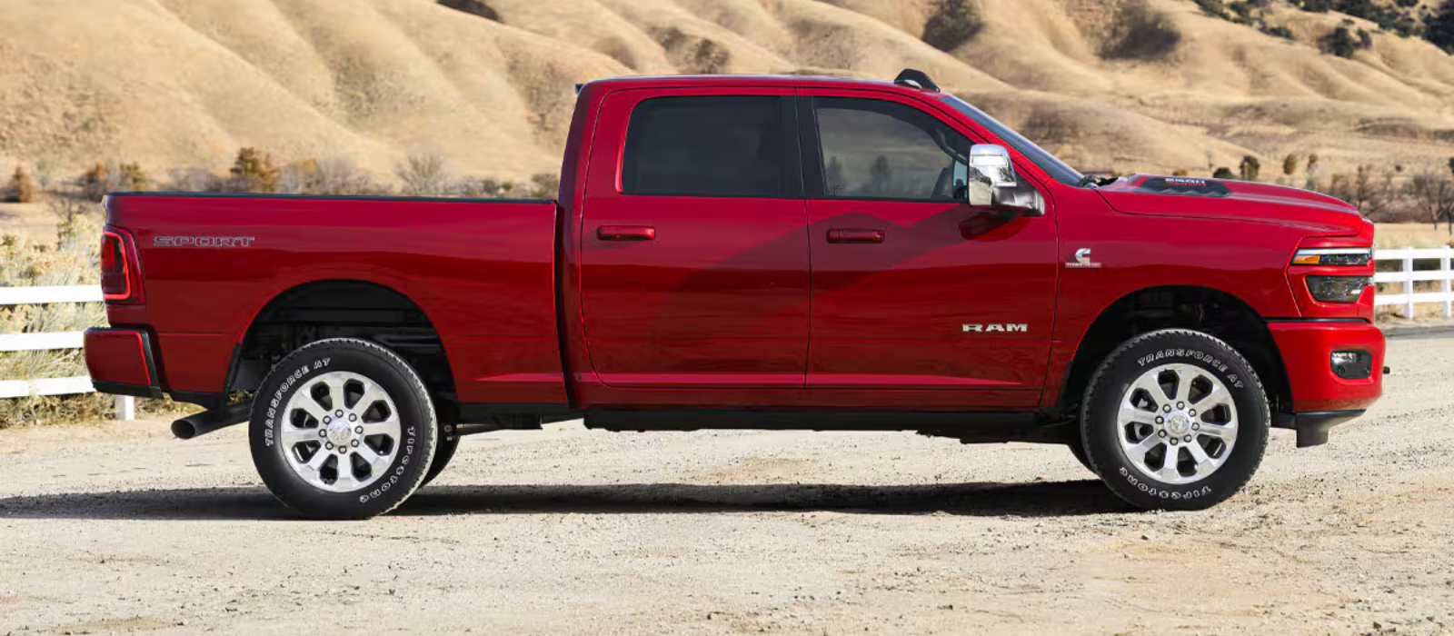 Red Ram 2500 Heavy Duty truck shown in a wide outdoor setting