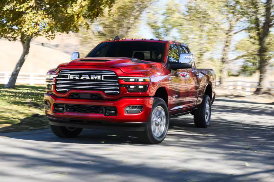 Red 2026 Ram 2500 Heavy Duty exterior shown for comparison