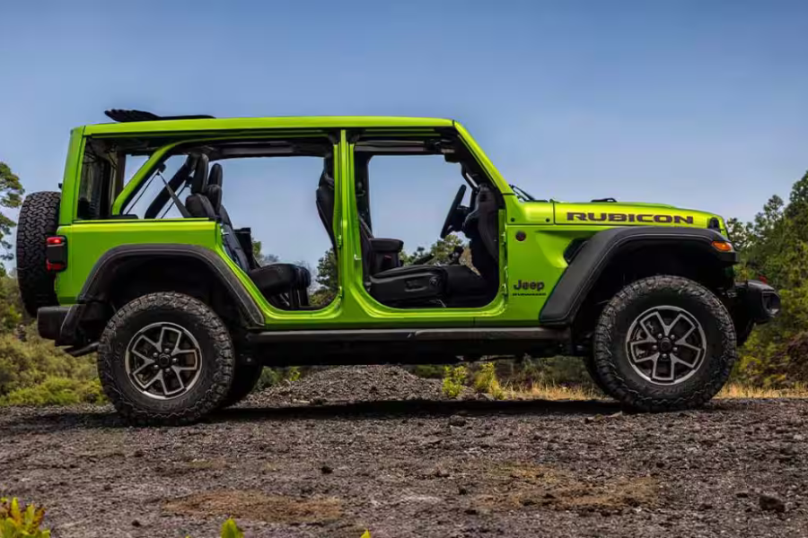 Green Jeep Wrangler Rubicon shown with its doors and roof removed